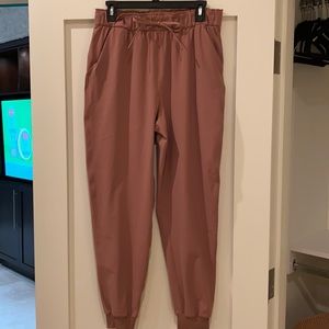 Lululemon On the fly Joggers, size 10. Barely worn, mauve pink in color.